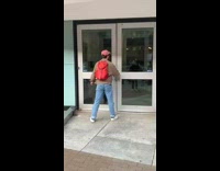 Man throws something on the ground and door opens