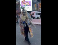 Two people shiny outfit walks with instruments