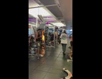 Group of men on their phone while inside the gym