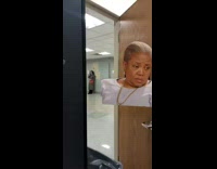 Lady on phone with mask over eyes 