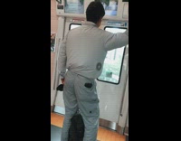 Guy rides train jacket built in fan 