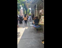 Guy face mask with colorful butterflies sidewalk 
