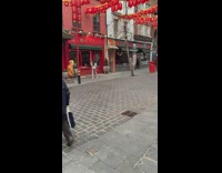 girl in beige photoshoot red lanterns Chinatown
