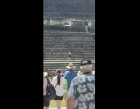 Guy does handstand on pyramid steps 
