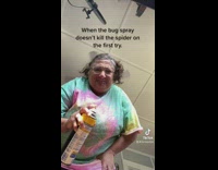 Lady sprays dancing girl with bug spray 