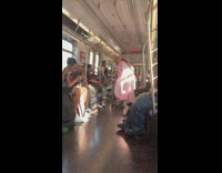 Donald trump in pink baby costume dances to Cardi B song on subway train