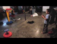 Kid throw and shoot football inside hoop