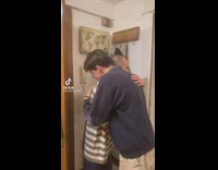 Two guys hugging making a beat guy singing