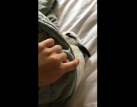 black and white bunny under green blanket 