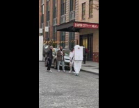 Guy dressed in astronaut suit pictures in street