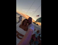 Woman films sunset boat ride with husband