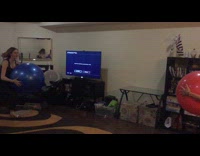 Women holds yoga balls bump each other