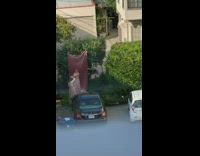 Two girls have photoshoot in alley 