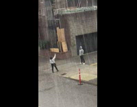 Guy poses outside while it is hailing