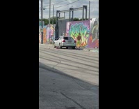 Man yellow leggings headband spin kick road