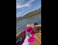 Girl poses on edge of boat then falls