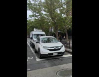 Man asking for money with DIY pole with cup