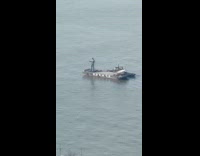 Collab WINY - Huge statue of man on boat river