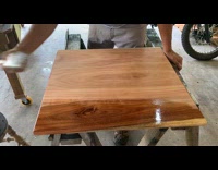 Man brush varnish on wood time lapse