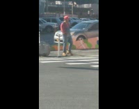 man in super mario costume dancing street