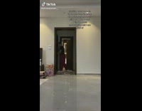 Guy looking through all doors in room 