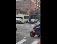 Guy wearing blue jacket dances in street