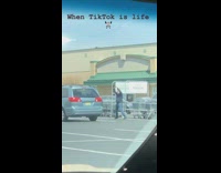 Man exercise beside car grocery parking lot