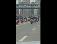 Biker gang on the freeway all riding scooters