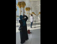 Guy picture in white gold temple hallway