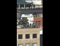 Zoom in white horse statue building rooftop