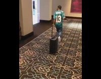 Collab Clips mpugc - Guy blue sports jersey walking remote luggage following