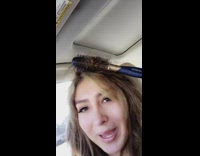 Girl driving hair brush stuck inside hair