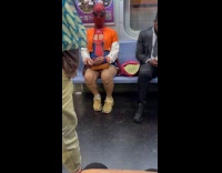 Woman wear spiderman mask costume ride train