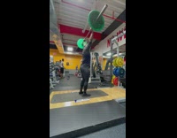 Man lift barbell do leg split gym