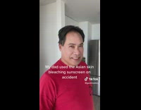 Man Checks Himself and Smiles Awkwardly at Camera