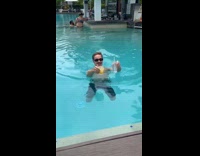 Collab Clips MPUGC - Guy swimming holding two drinks