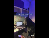 Guy on phone scrolling close laptop