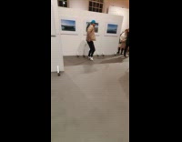 Man dances near DJ inside the museum