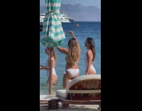 Kid film three women white bikini beach