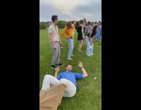 Guy jumps across grass to win race