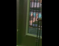 Woman white bikini takes picture of man white shirt