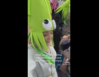 Girls buy funny hats at aquarium