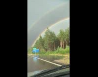 Double rainbow seen in rainy car ride