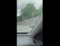 Car with slanted front wheel on highway