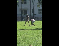 Girl camo shorts park dance pink shirt guy