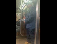 Grey beanie guy blasts music sings subway 