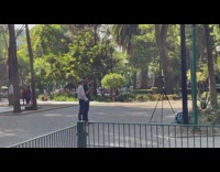 Two Guys Talk to Camera at Park for Video 