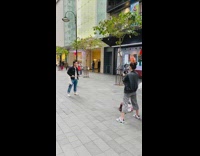 Guy uses mop air guitar camera crew