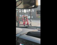 Girl plank over metal gate red scooter