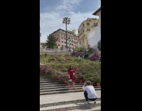 Girl red dress hold bag spanish steps 